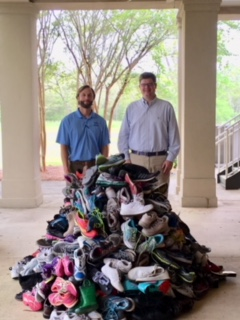 Dr. Harcourt and Dr. Chamblee with collected shoes